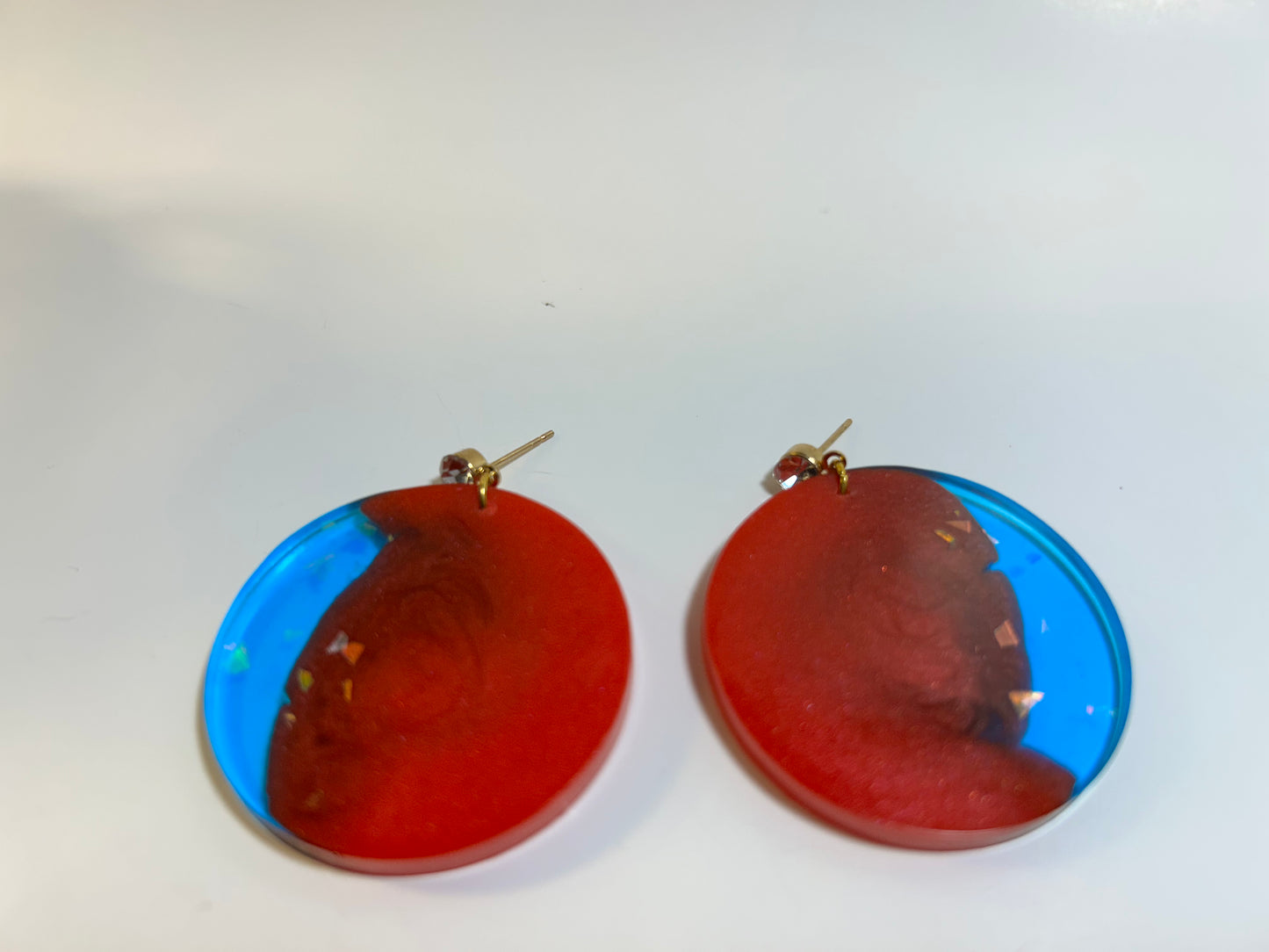 Red and blue circular earring